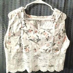 A cotton laced blouse with the Paris Eiffel tower prints on it.